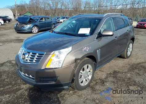 2014 Cadillac Srx Luxury Collection z USA, uszkodzony, nr VIN 3GYFNBE39ES583575